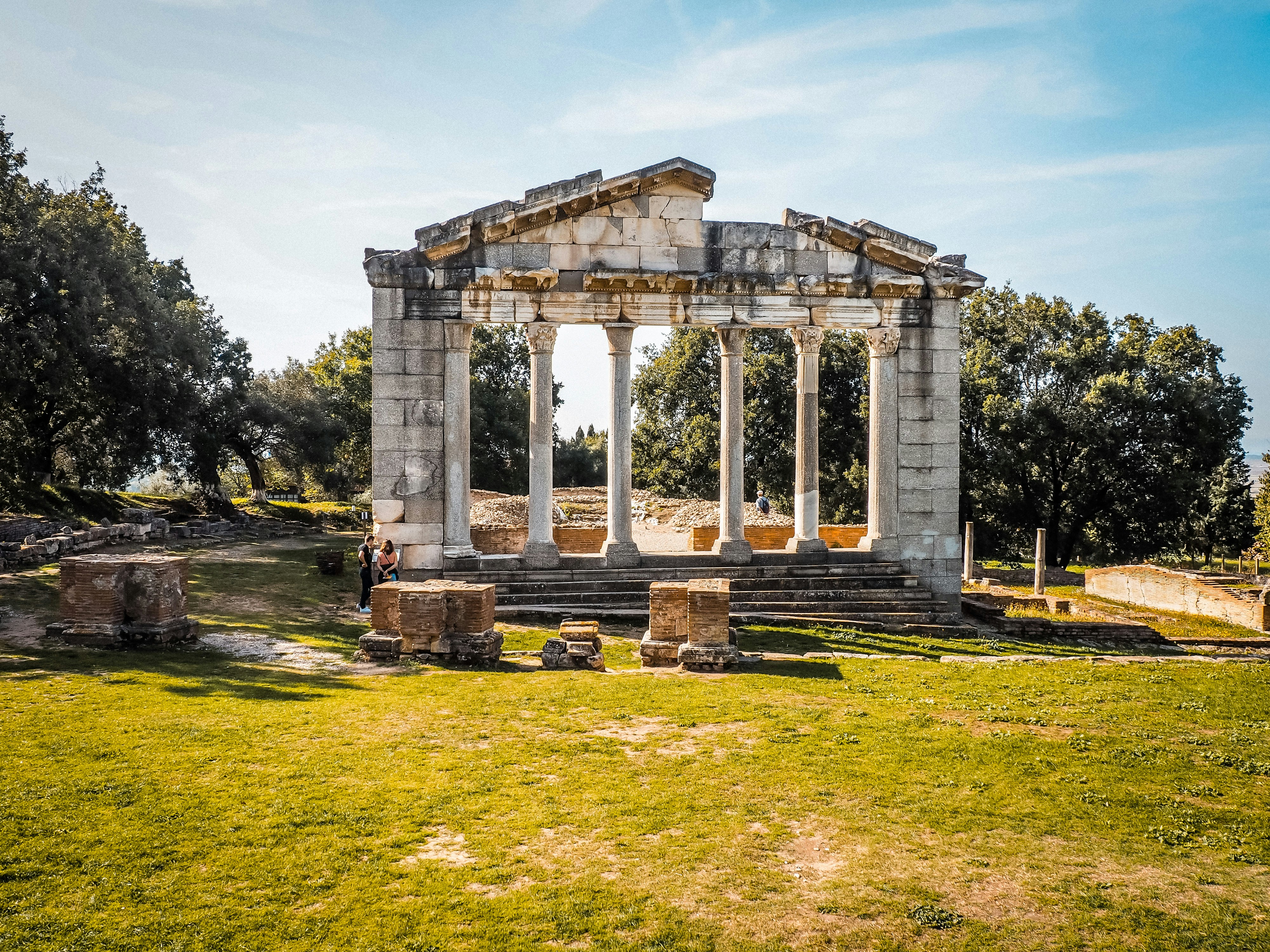 An ancient temple stands under a sunny sky.