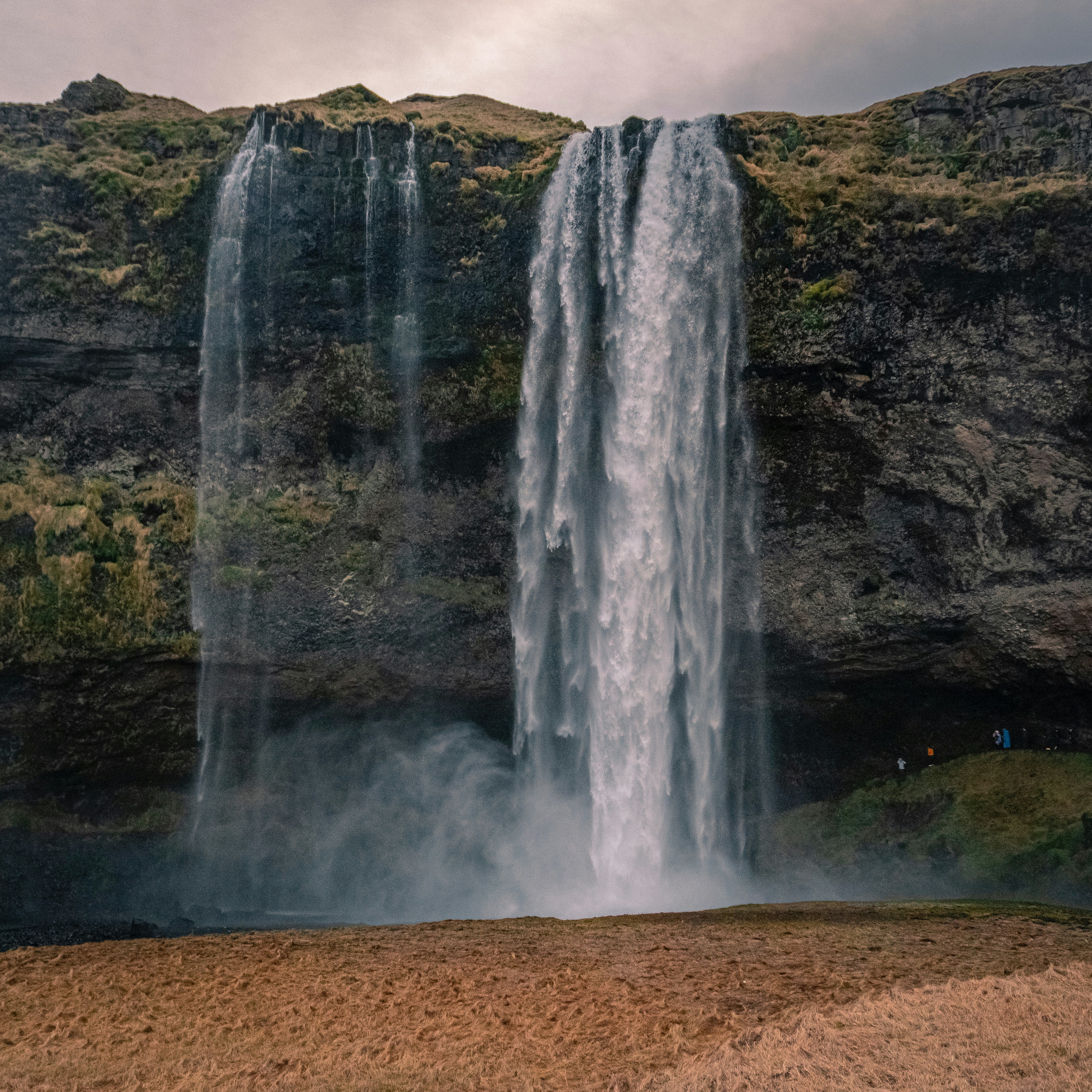 Majestic waterfalls cascade down a rocky cliff. photo – Free Human ...