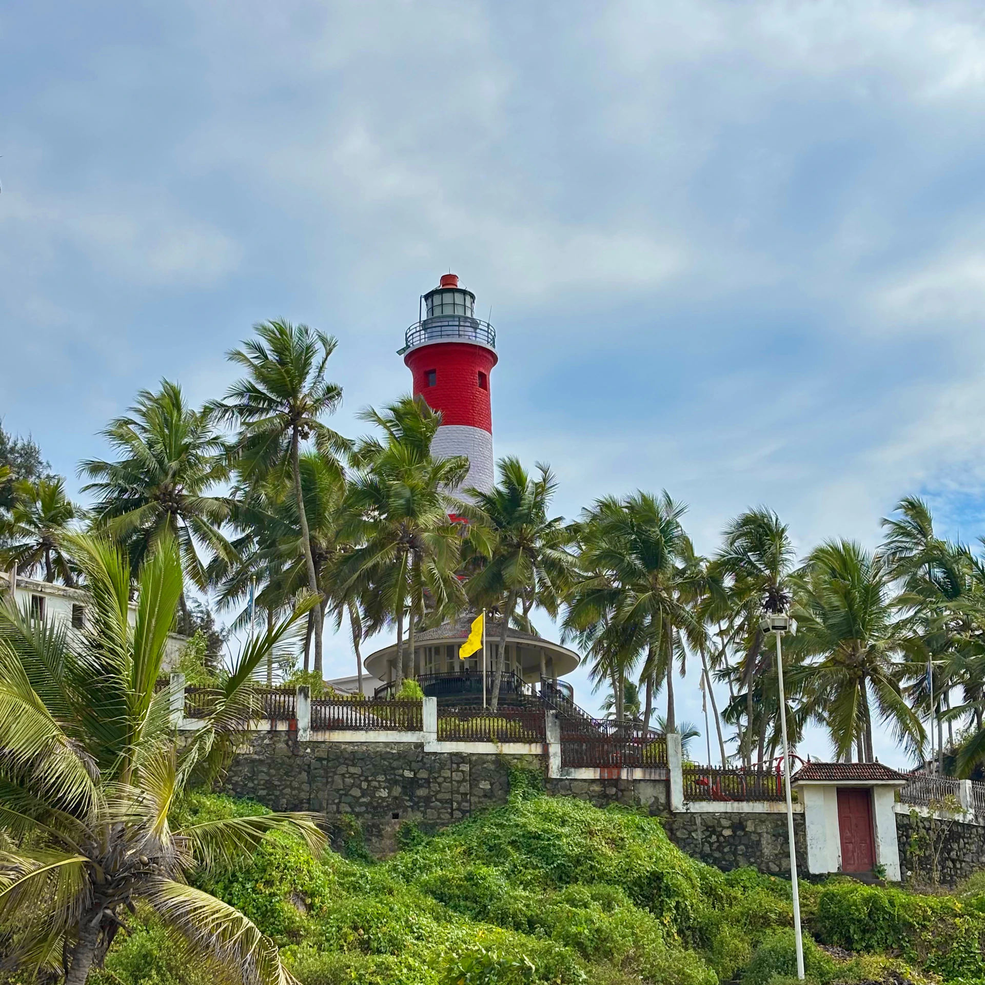 A striking red and white lighthouse stands tall
