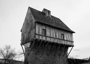 Ancient, wooden house with a unique design.