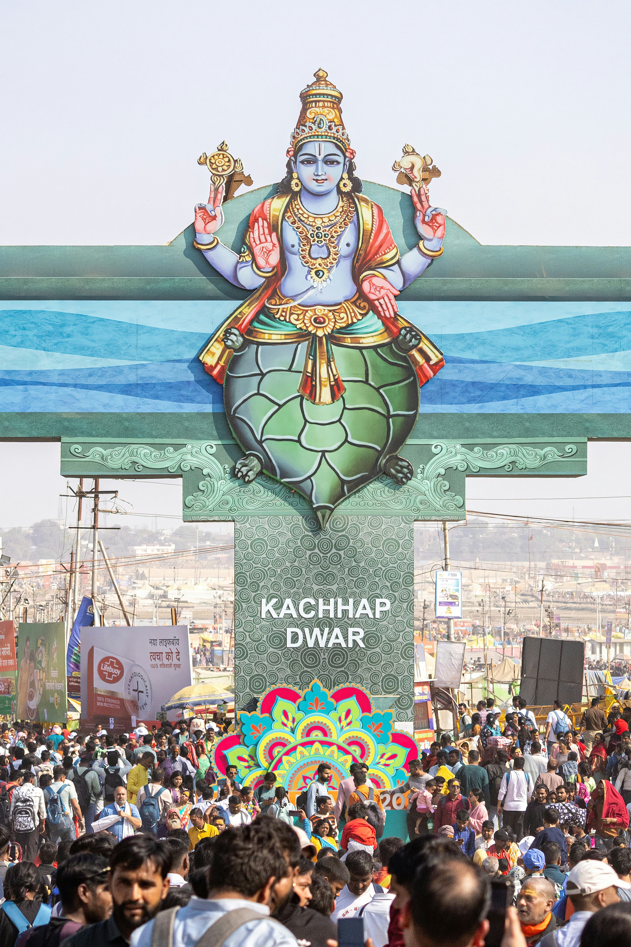 A crowd gathers before a religious monument.