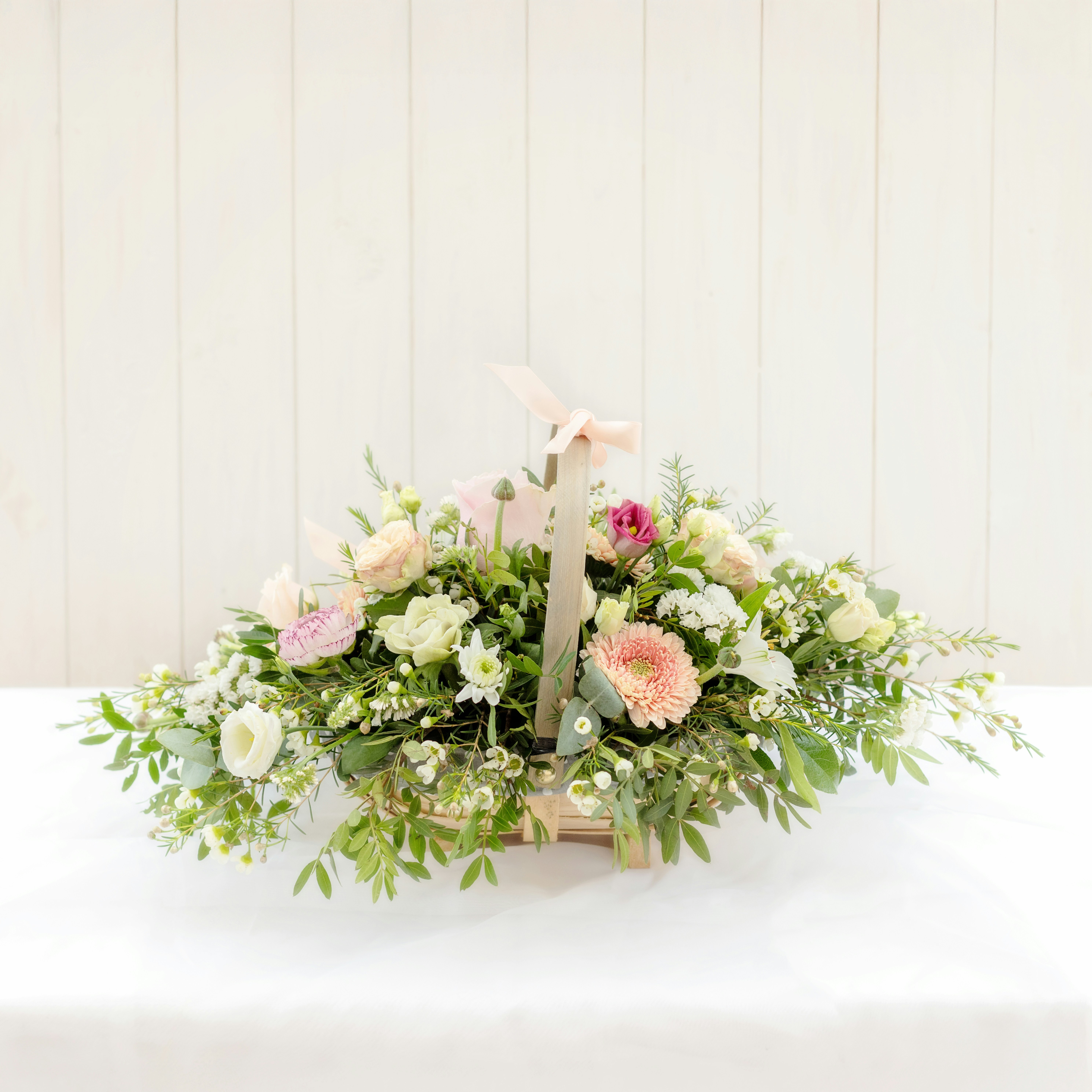 A basket filled with beautiful, fresh flowers.