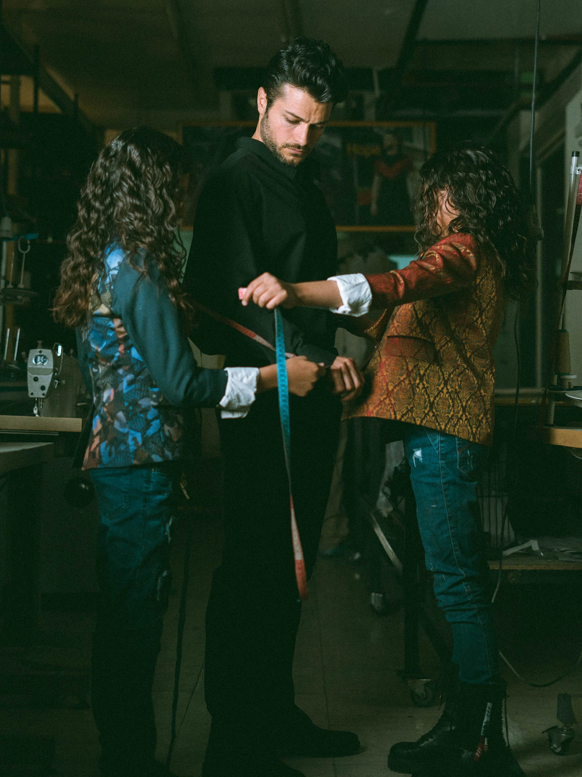 Tailor measuring a man's waist with a tape measure, illustrating the waist reduction men see with tirzepatide weight loss.