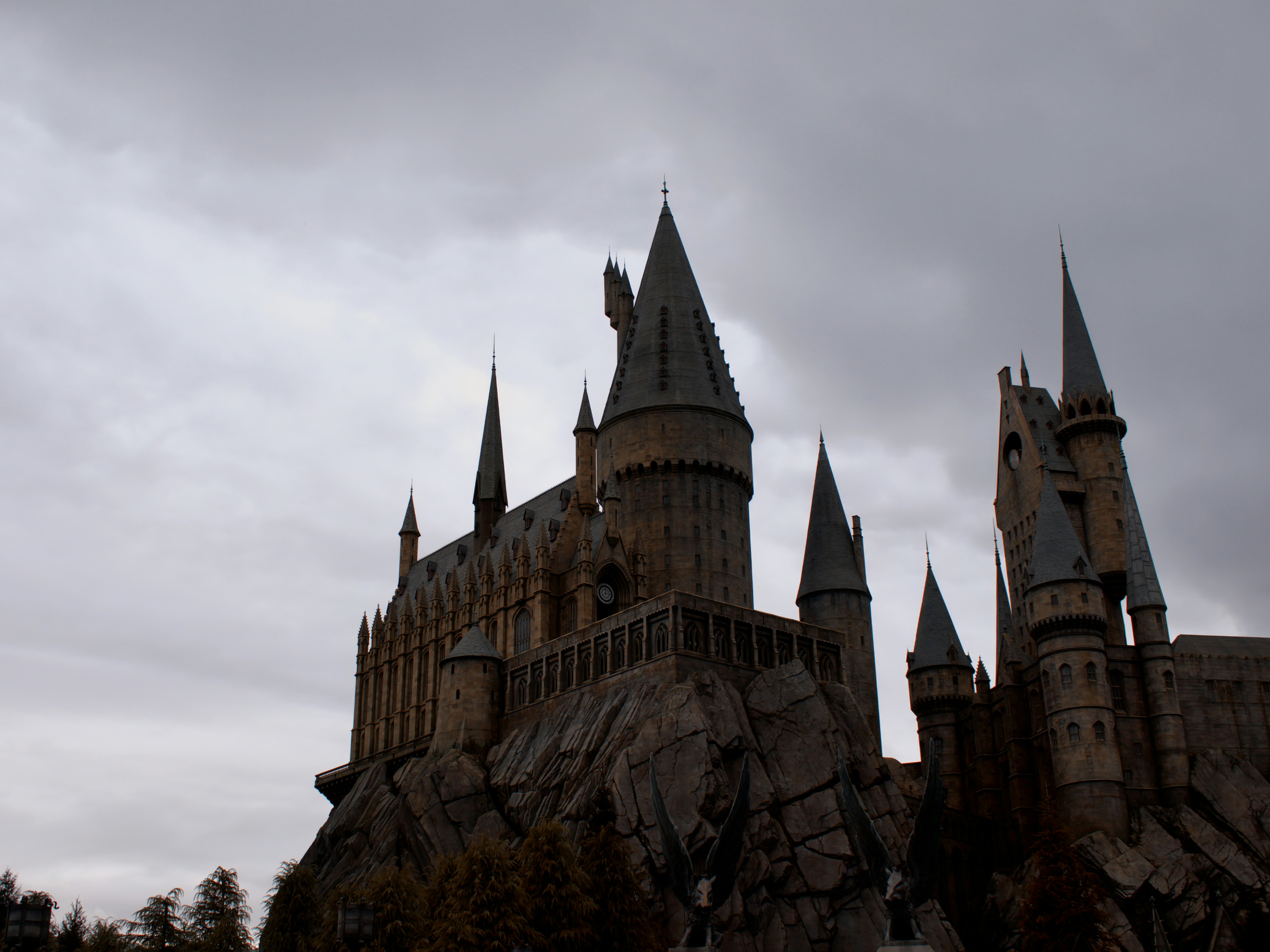 Hogwarts castle sits under a cloudy, gray sky.