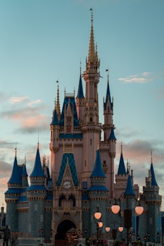 Cinderella's castle stands tall in the evening.
