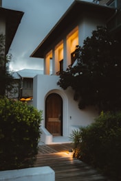 A cozy house with a lit interior.