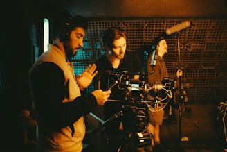 Film crew working with camera and microphones.