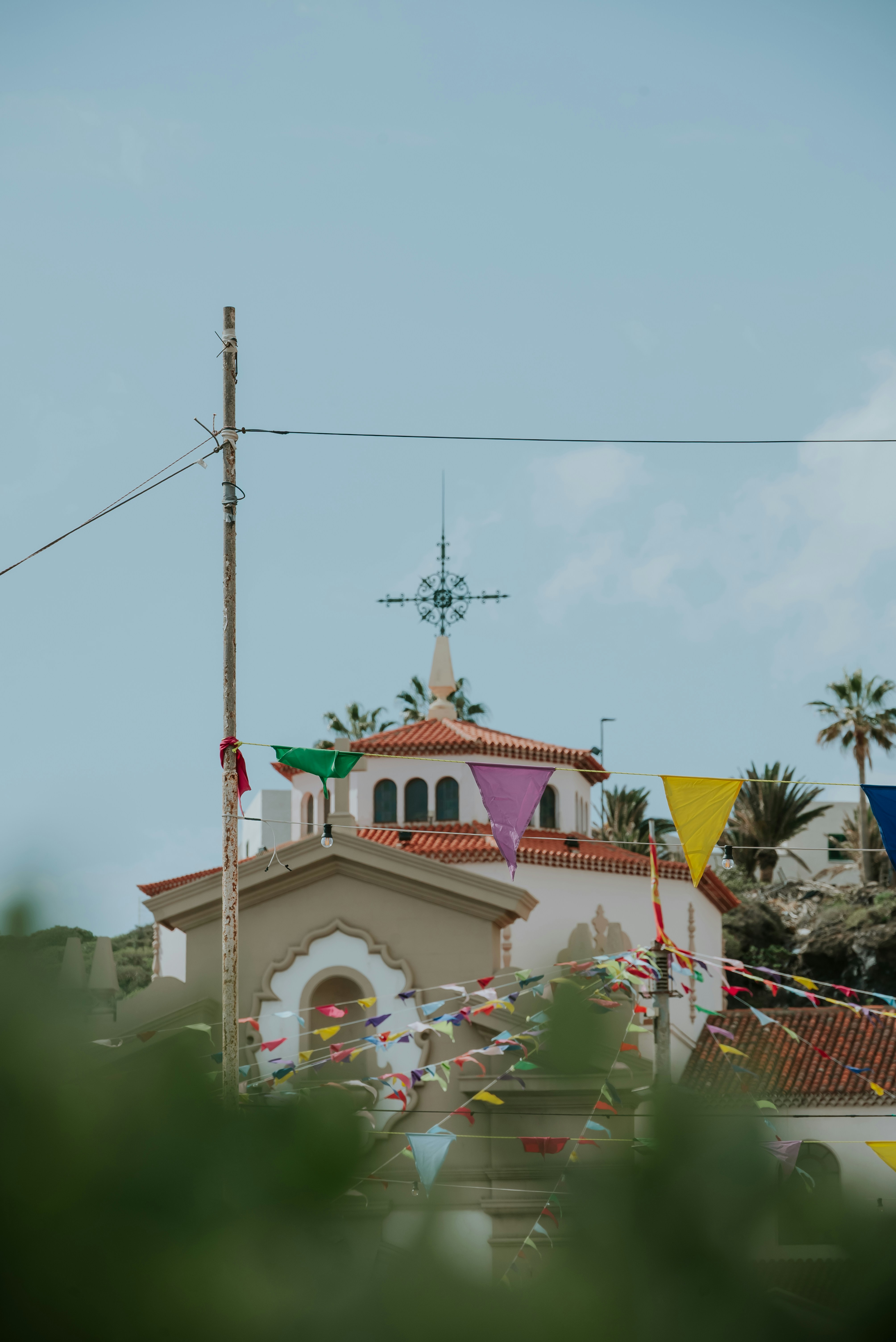 Church decorated with colorful flags.