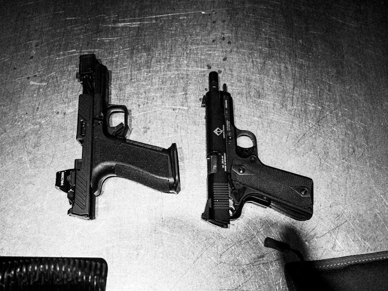 Two handguns on a surface