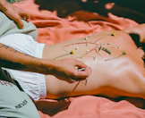 Someone's back is adorned with flowers.