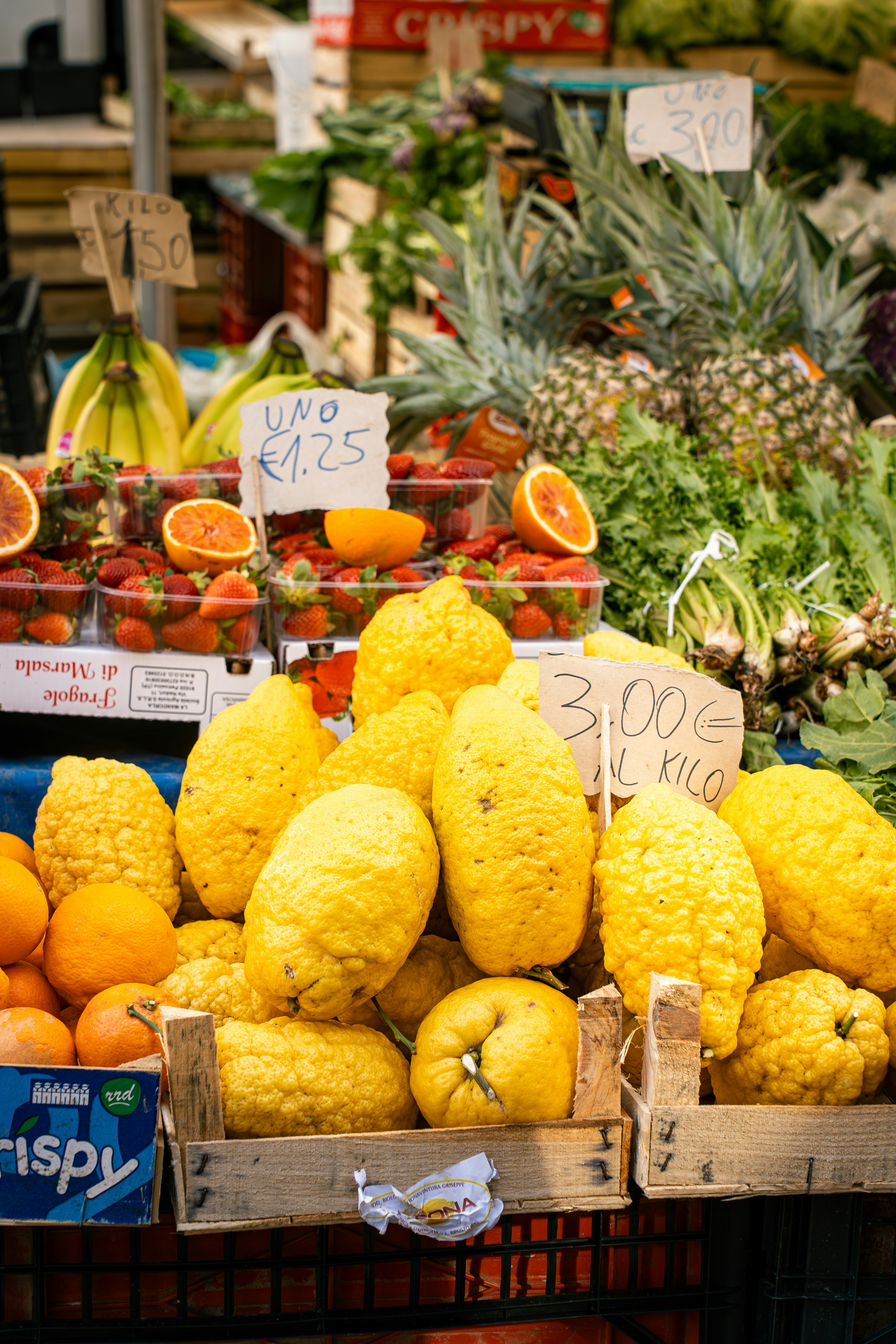 Fresh fruits and vegetables are displayed at the market.