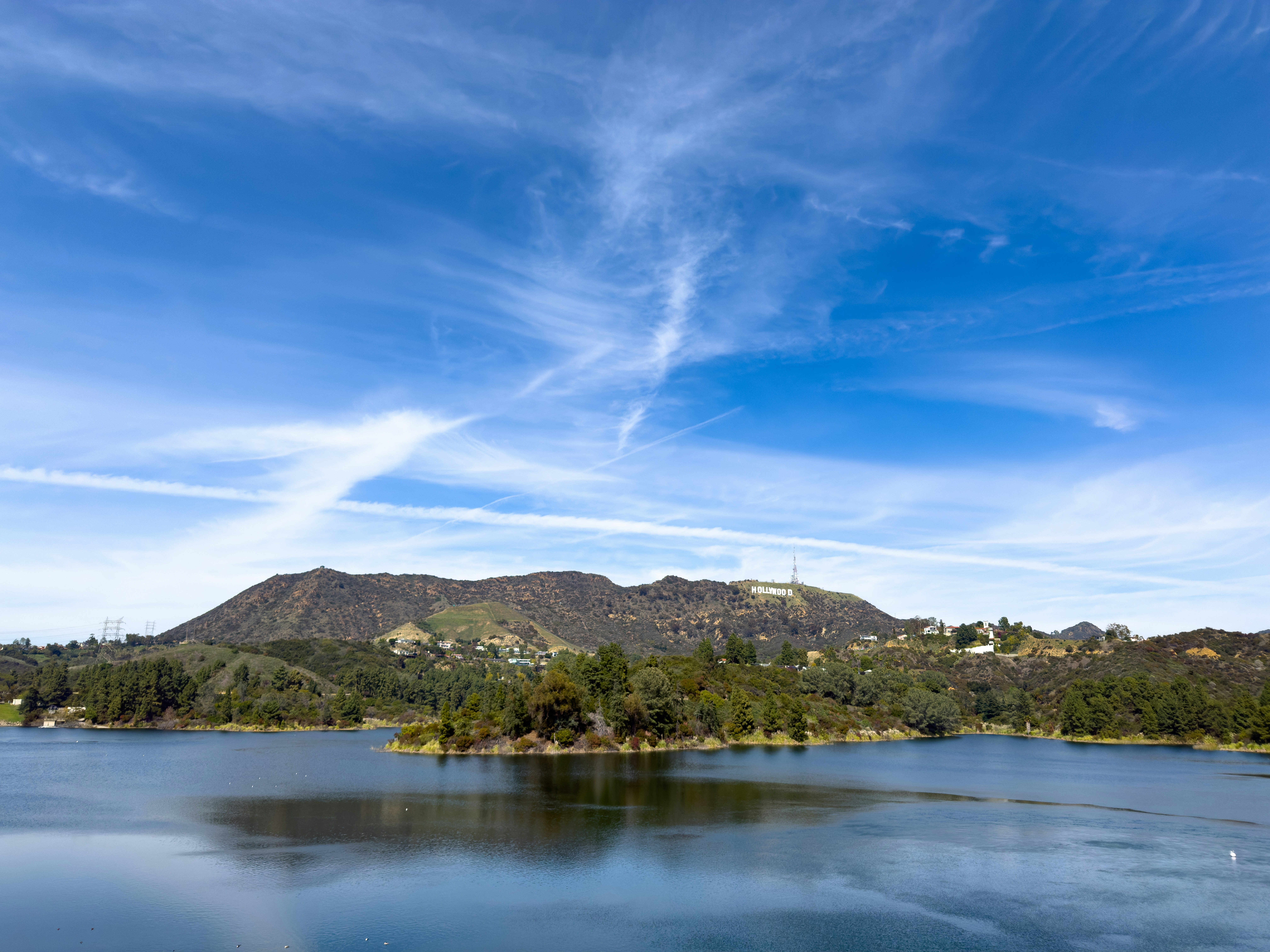 Lake and mountains under a blue sky.