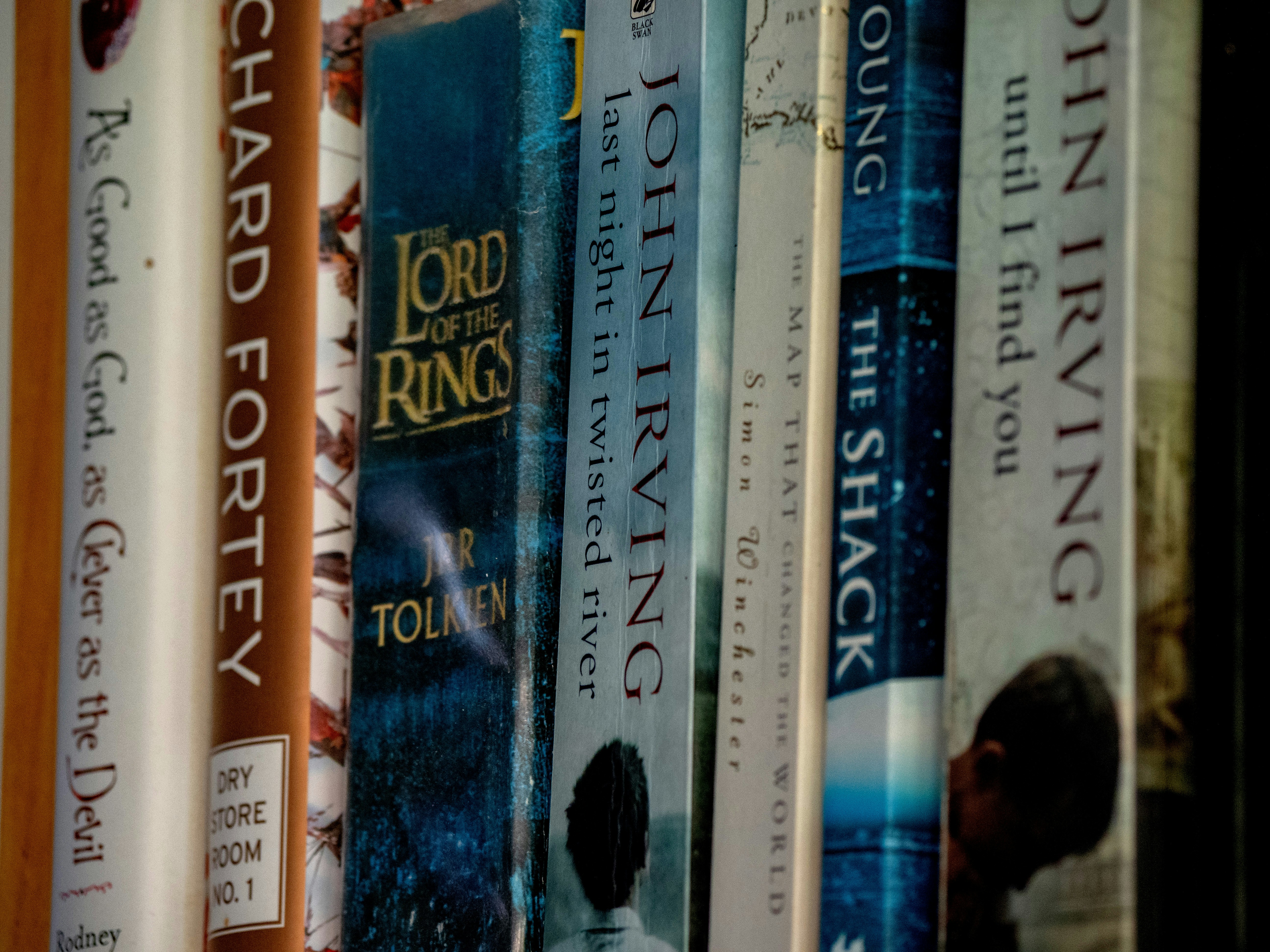Books are lined up on a bookshelf