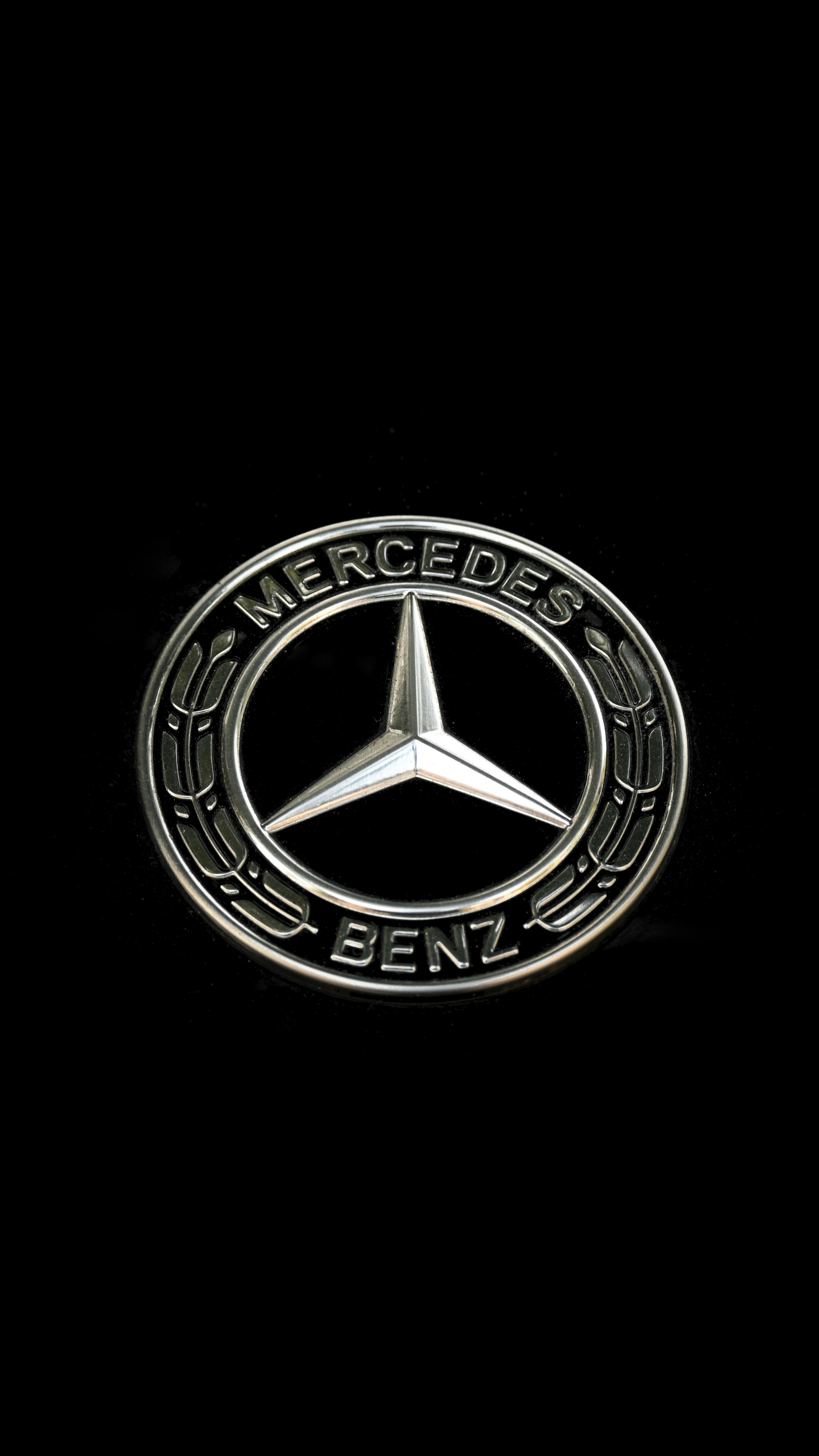 The mercedes-benz logo on a black background.