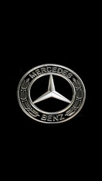 The mercedes-benz logo on a black background.
