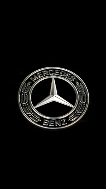 The mercedes-benz logo on a black background.