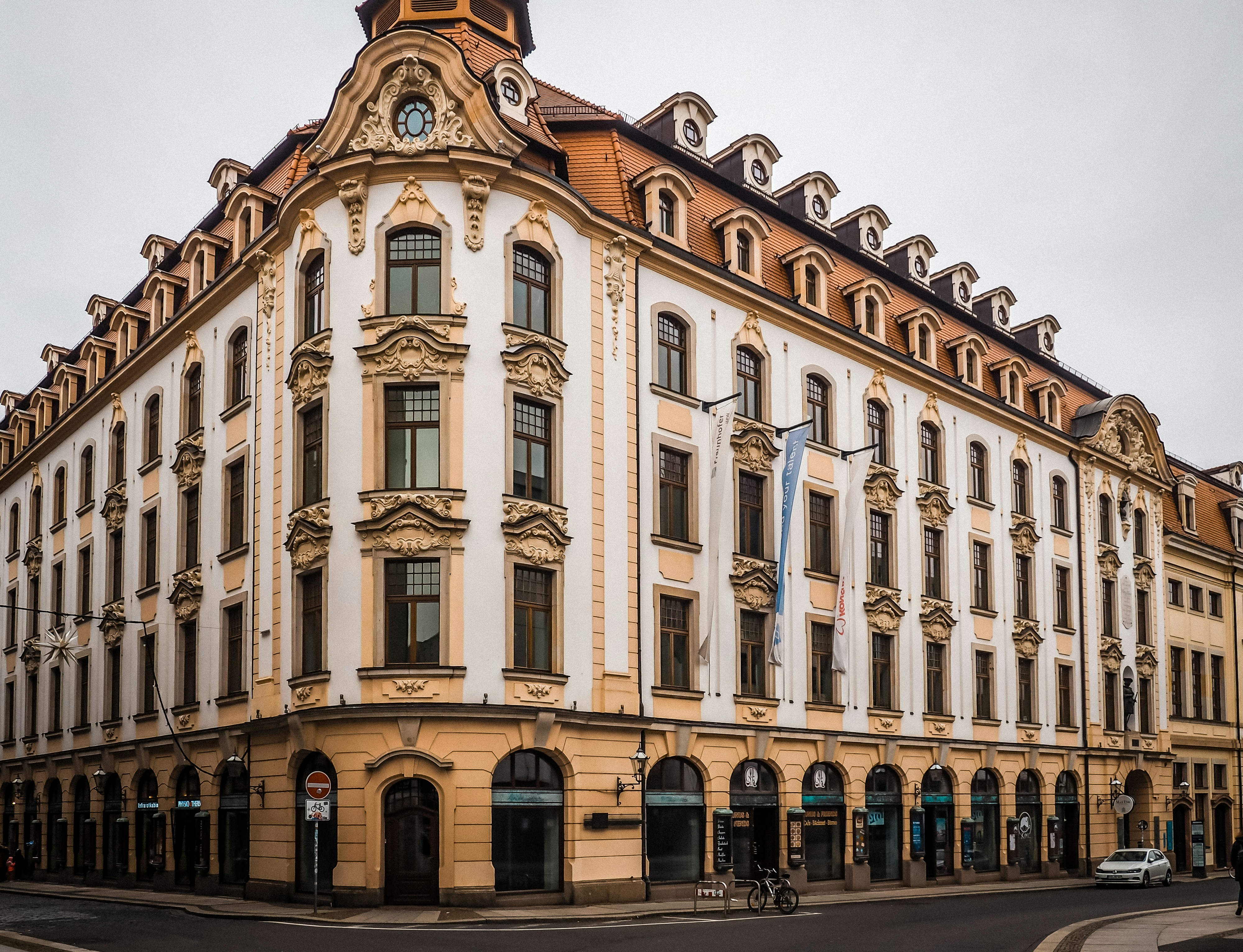 Elegant corner building with ornate details.