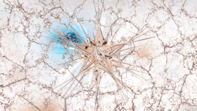 A star-shaped object rests on a cracked surface.