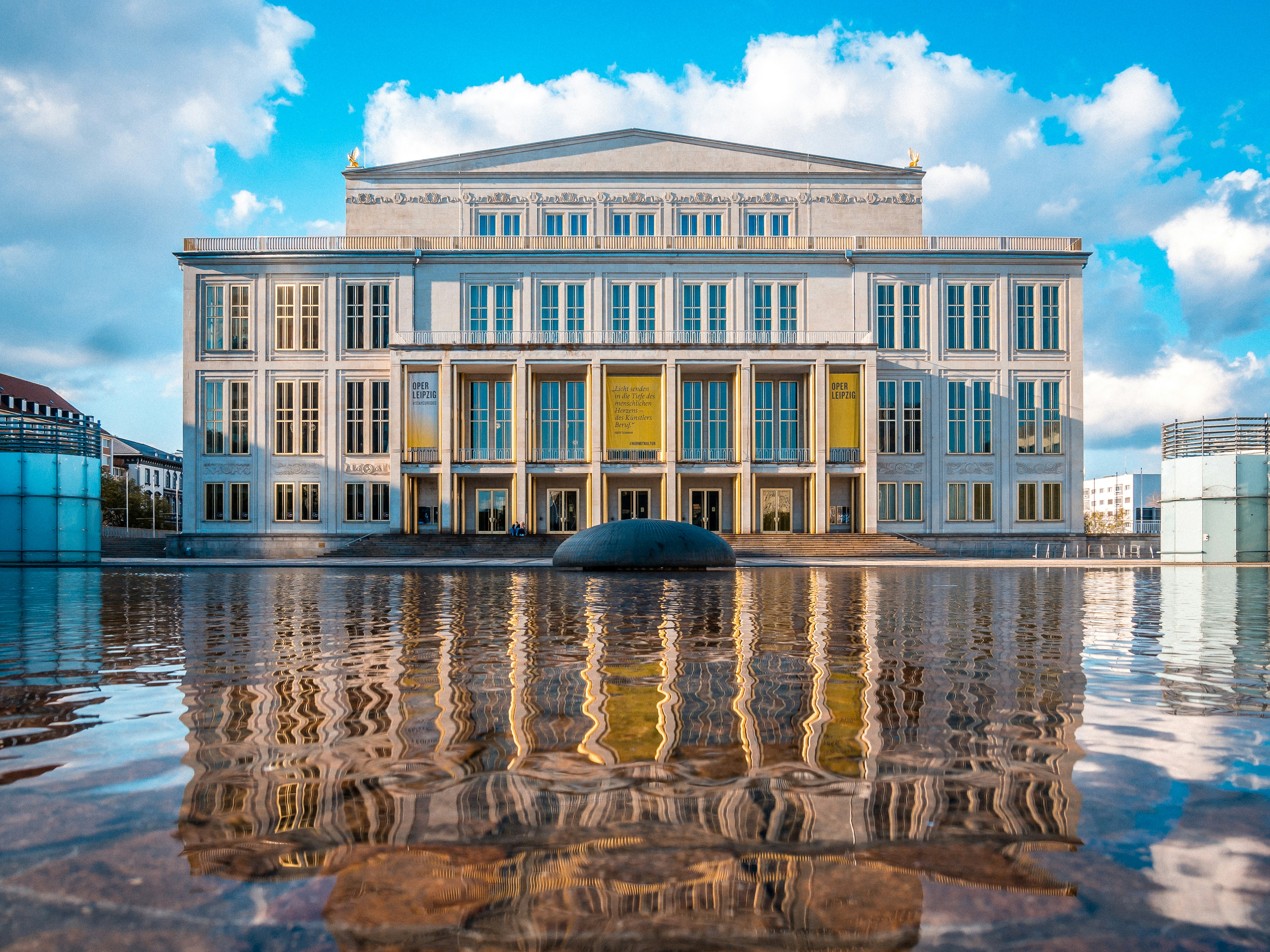 A beautiful opera house with mirror reflection.