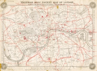 Antique pocket map of london showing streets and river.