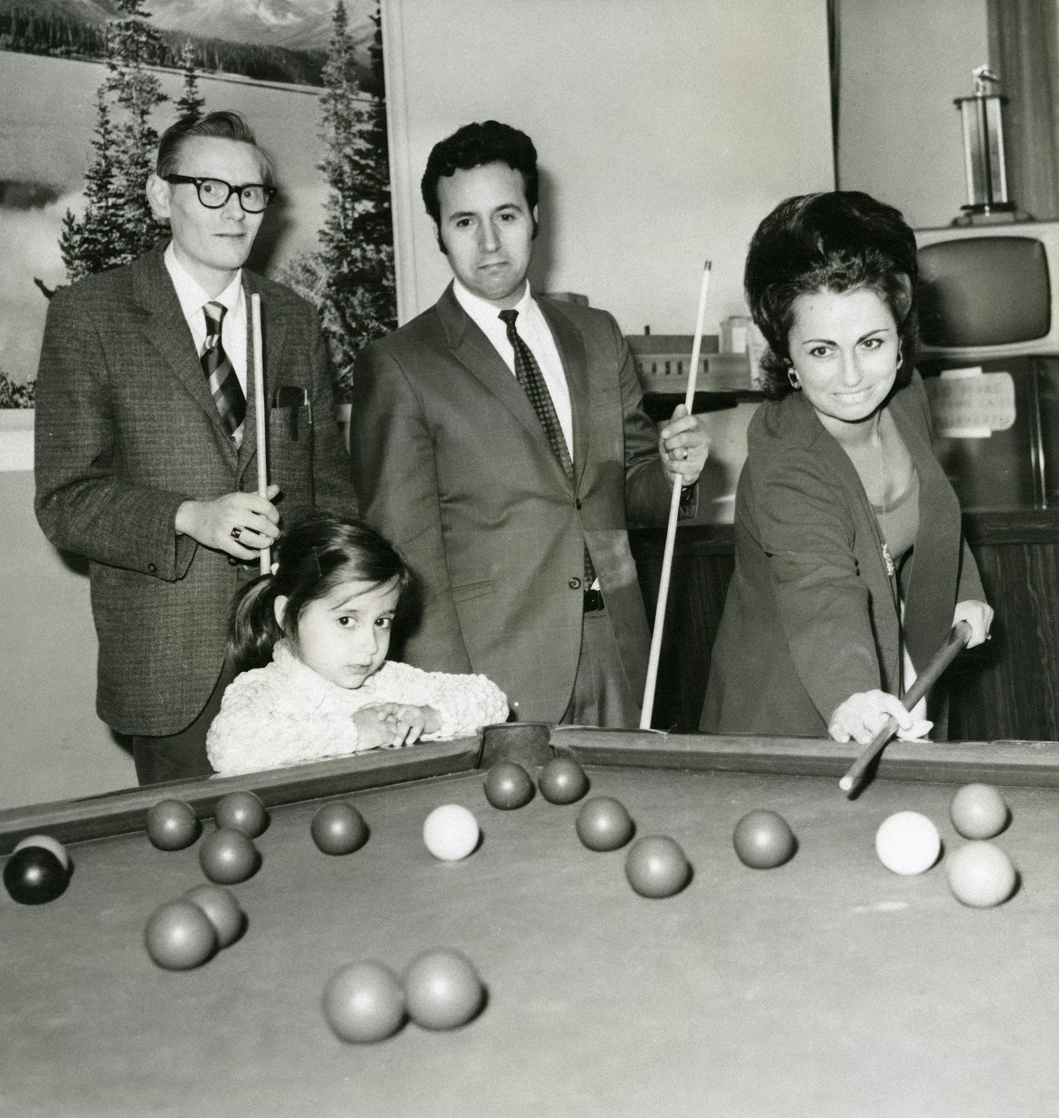 A golf ball with a custom photo stamp depicting a family picture