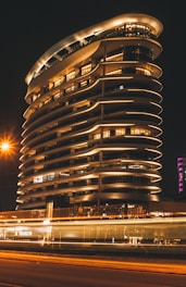 Lit up modern building at night.