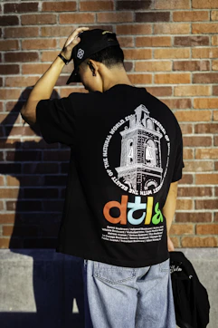 Man wearing a black shirt with a graphic.