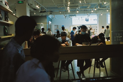 People browse a modern shop in a store.