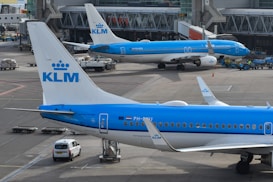 Klm airplanes parked at the airport.