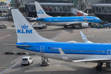 Klm airplanes parked at the airport.