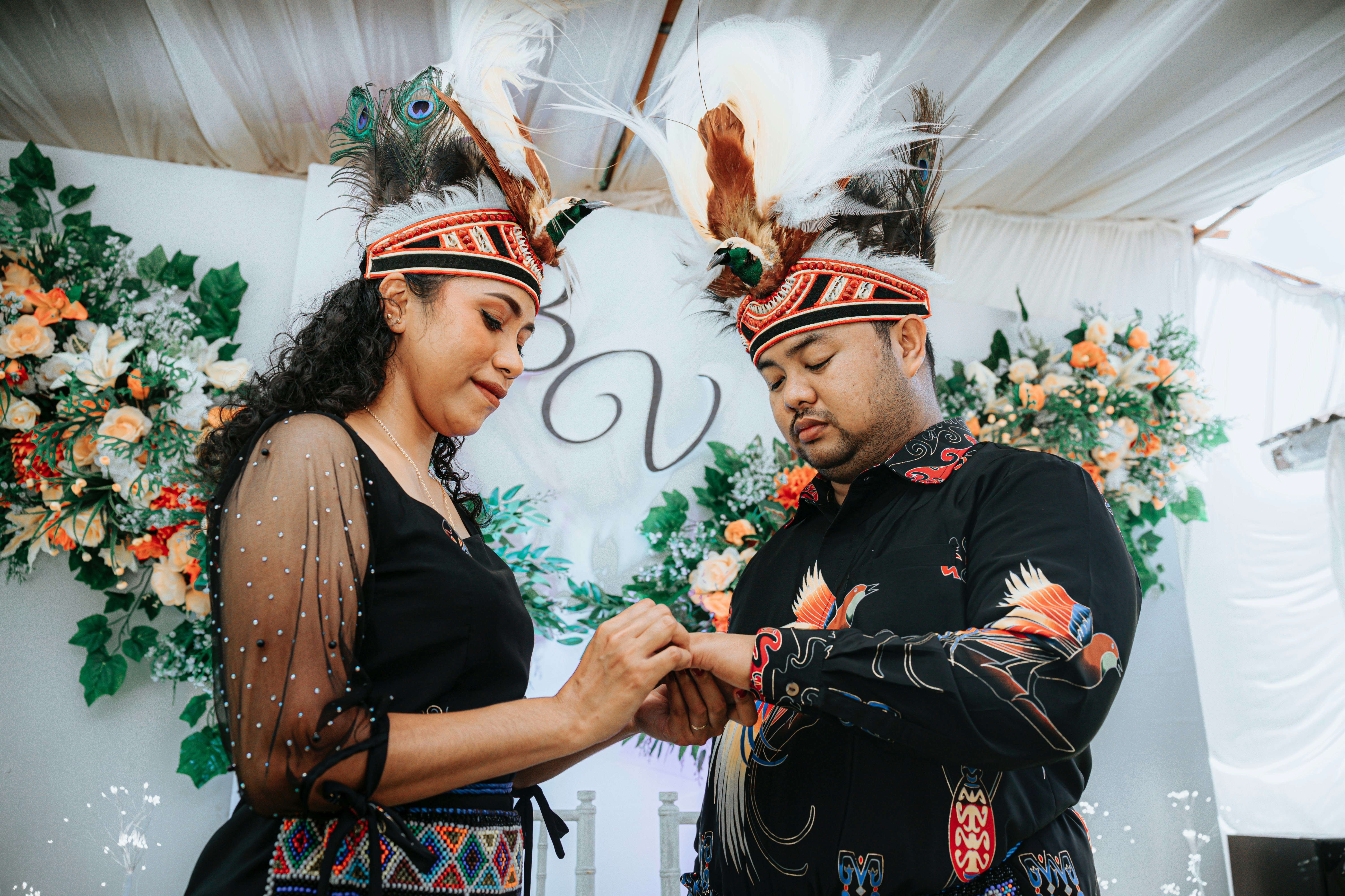 Couple exchanging rings at wedding ceremony