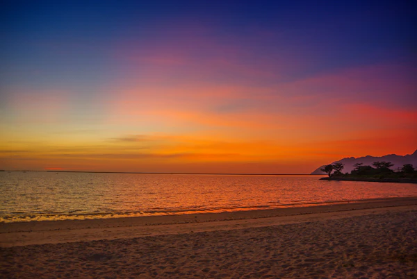 Sunset colours over the sea and beach on Langkawi Island