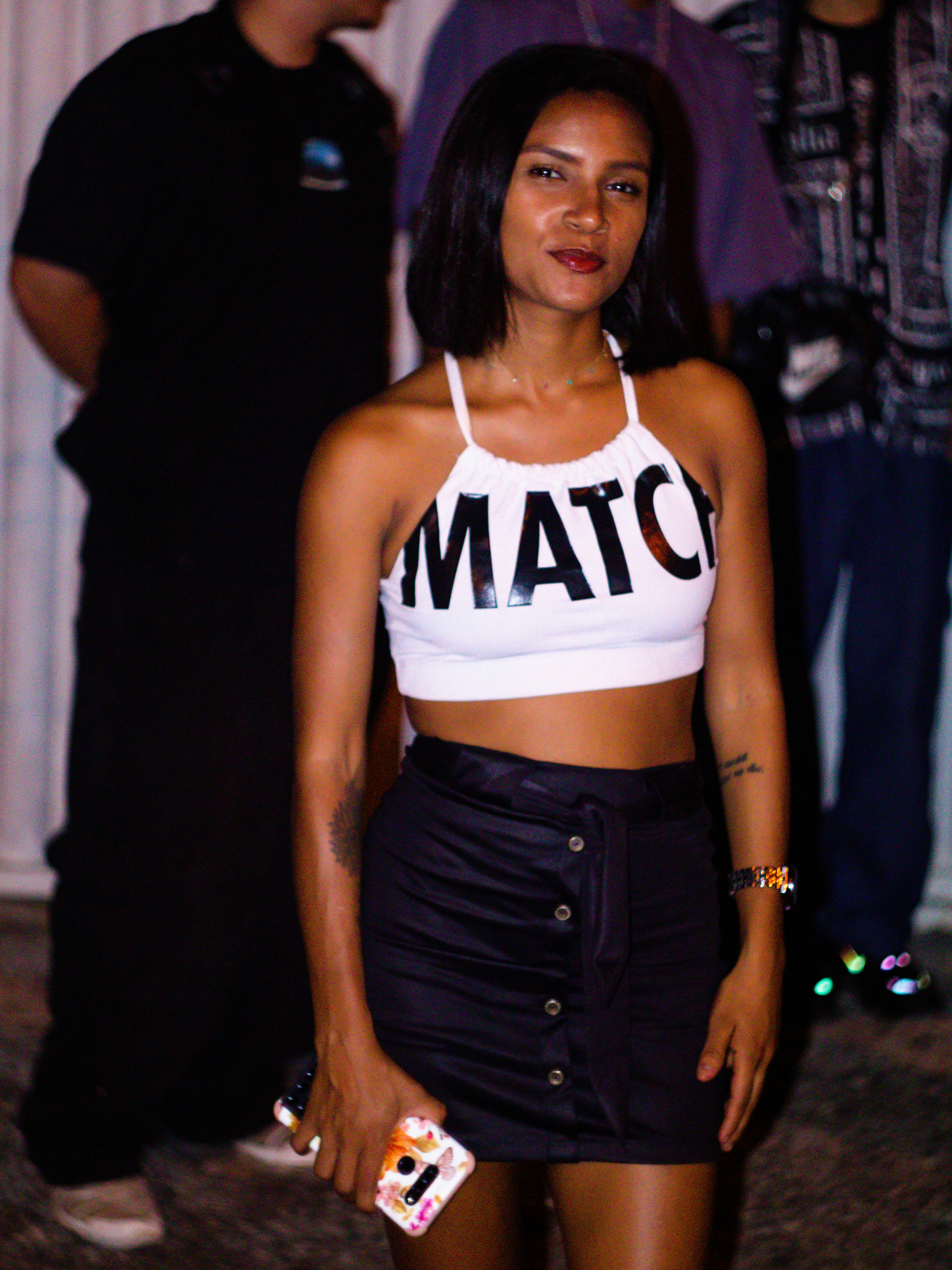 A woman in crop top and black skirt poses. photo – Free Woman Image on ...