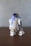 Here is a caption: r2-d2 from star wars standing on a table.