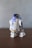 Here is a caption: r2-d2 from star wars standing on a table.