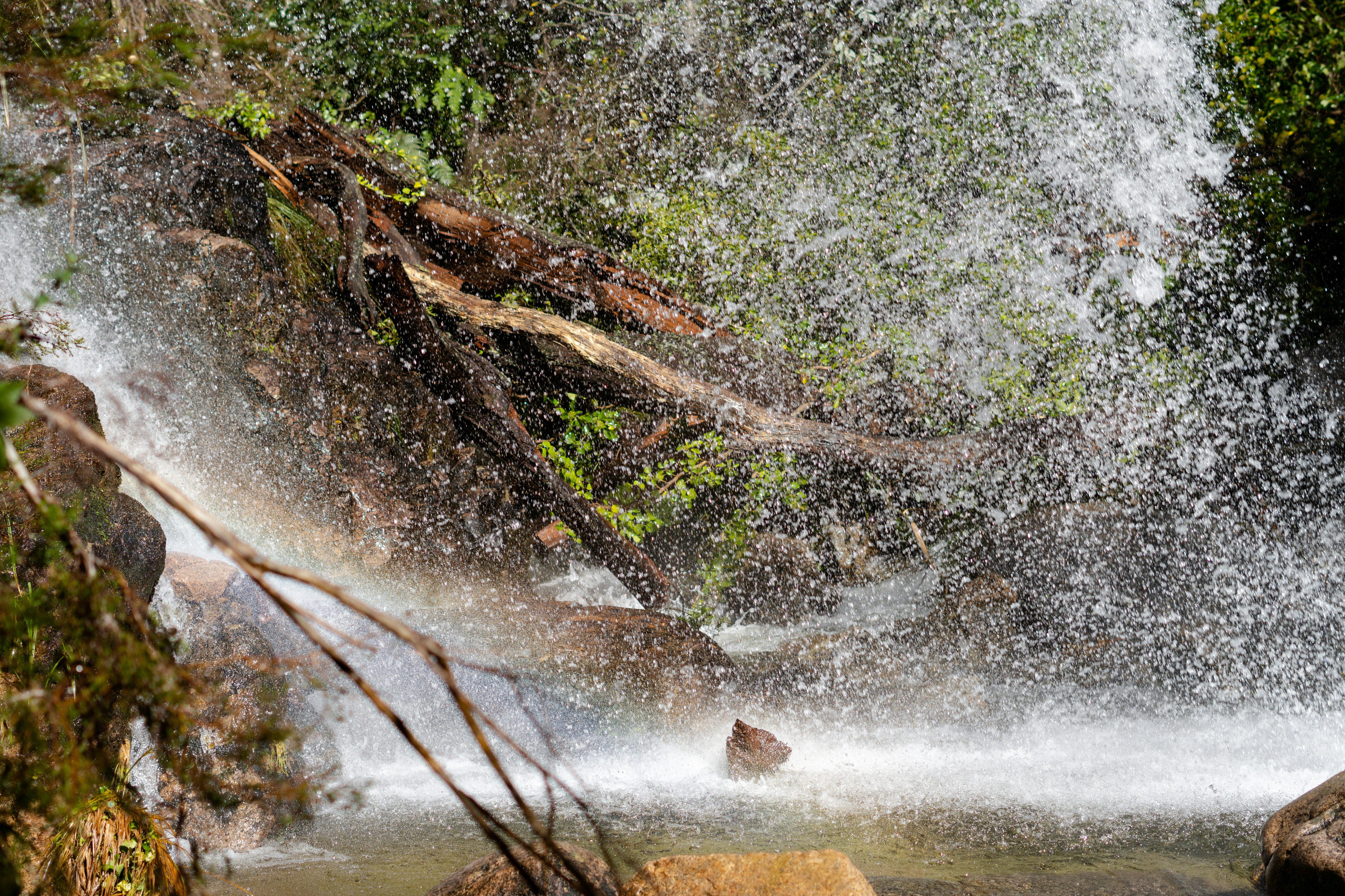 Water cascades down a rocky waterfall.