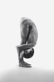 A person is in a difficult yoga pose.