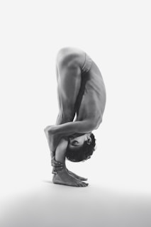 A person is in a difficult yoga pose.