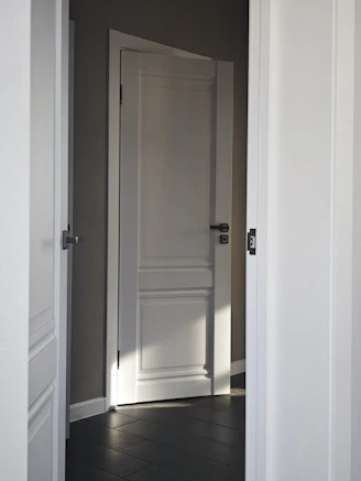 An open door reveals a room.