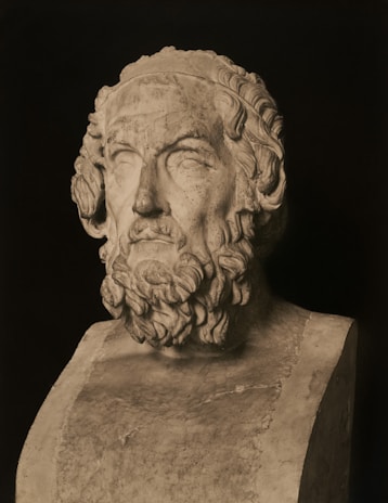 A stone bust of the greek poet homer.