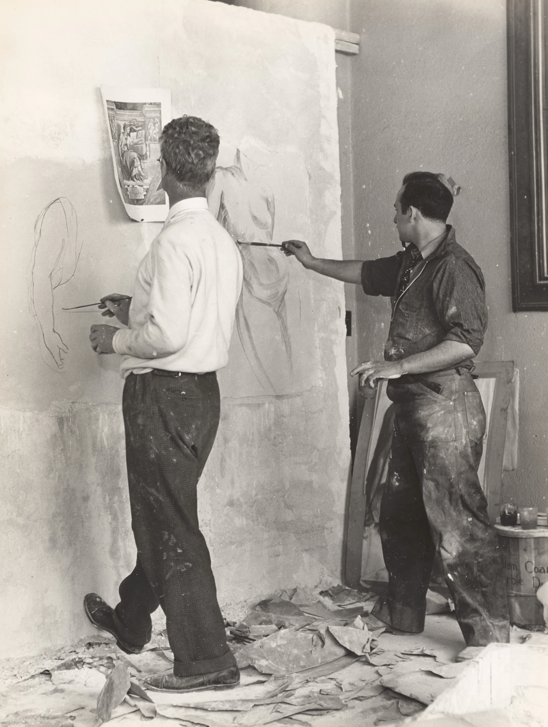 Two artists working together in a studio