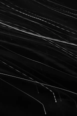 Abstract streaks of light against a dark background.