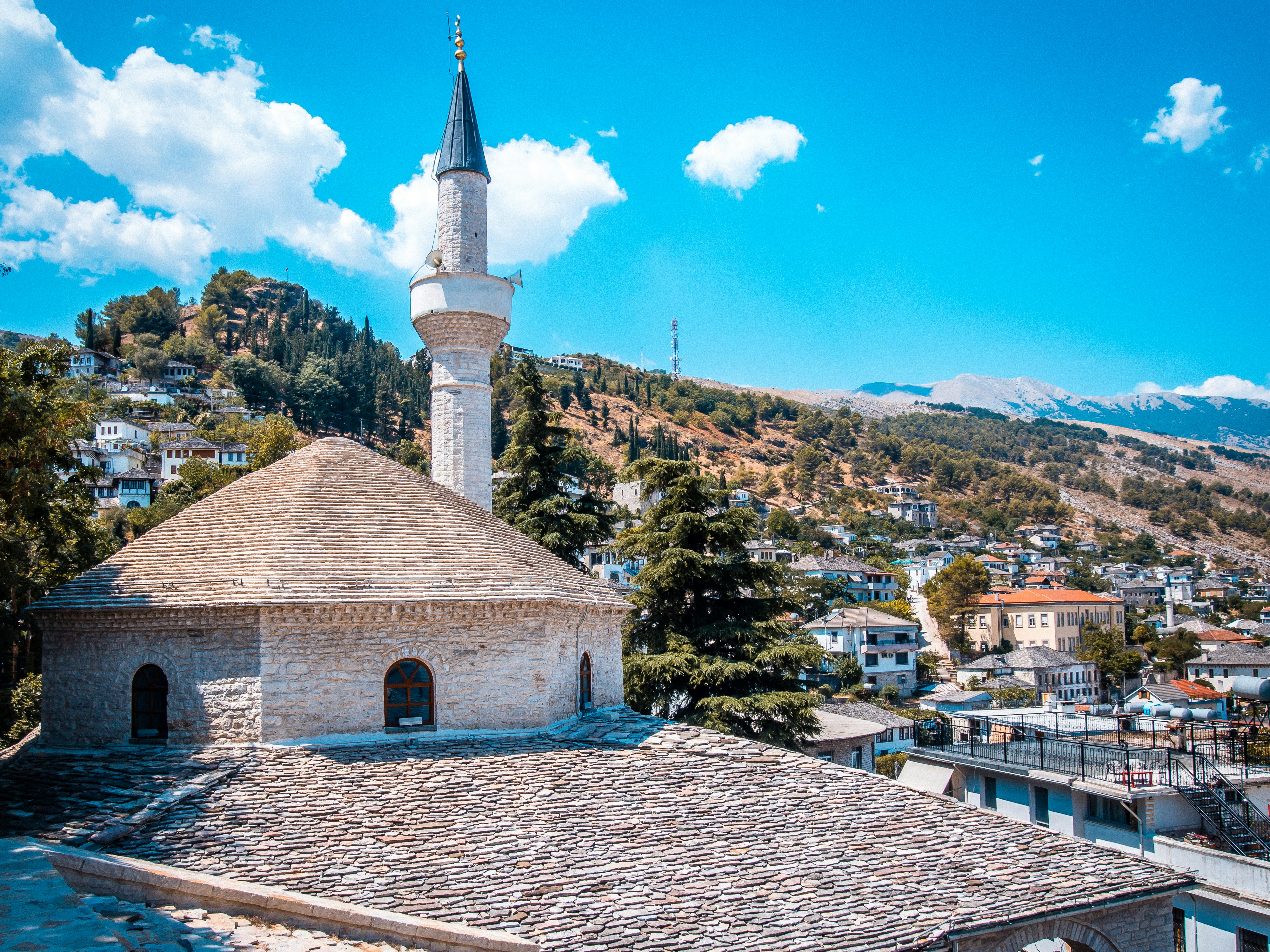 A mosque with a minaret in a scenic landscape., Bazaar Mosque in Gjirokaster Albania. When using my images, please cite me as follows: Dirk Pohlers / Adventure Albania Travel Blog and link to my website: www.adventurealbania.com