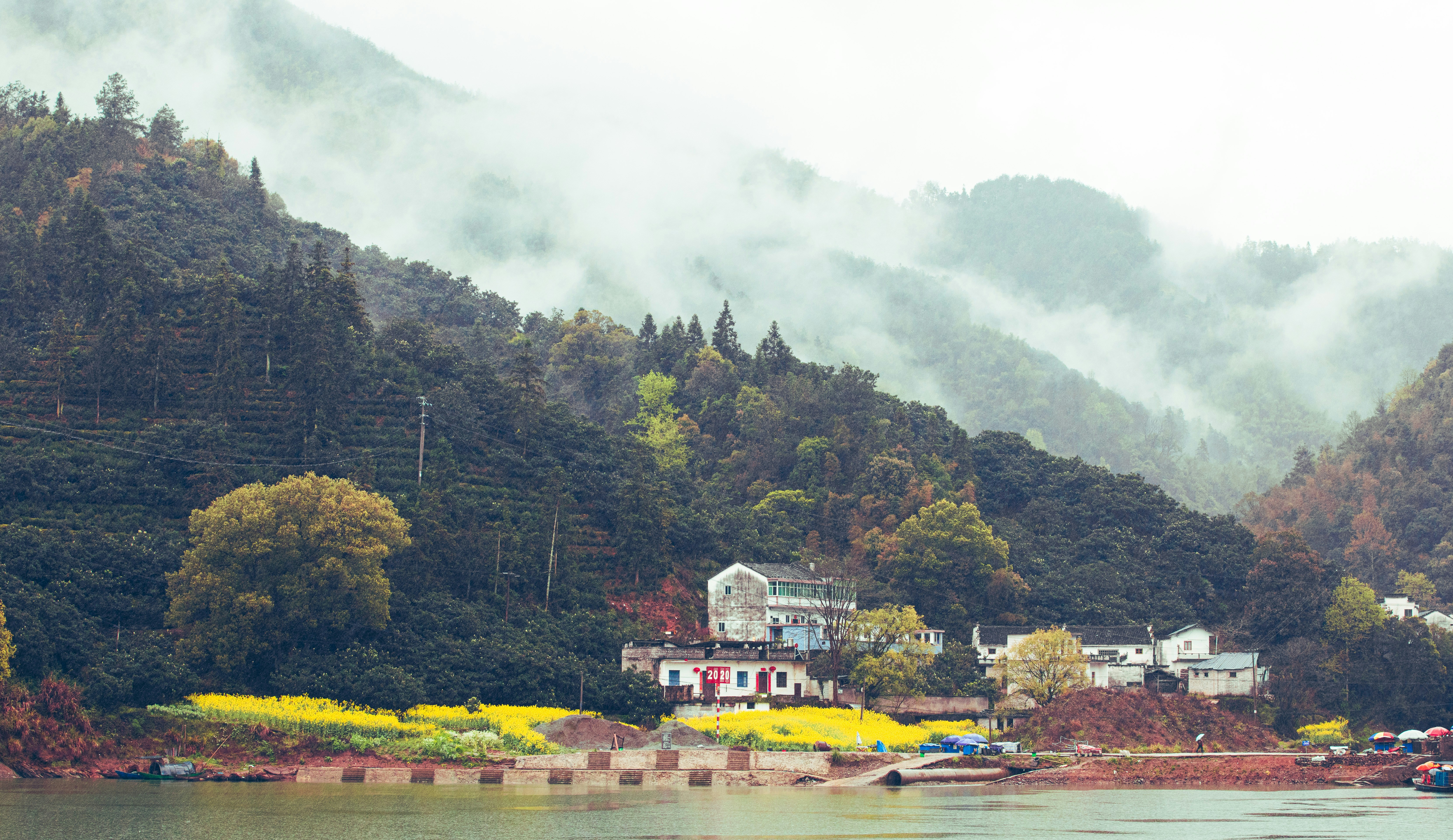Scenic mountain village nestled beside a lake.
