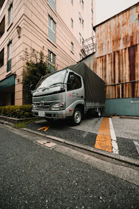 A delivery truck is parked on the street.
