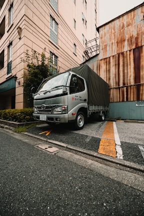 A delivery truck is parked on the street.