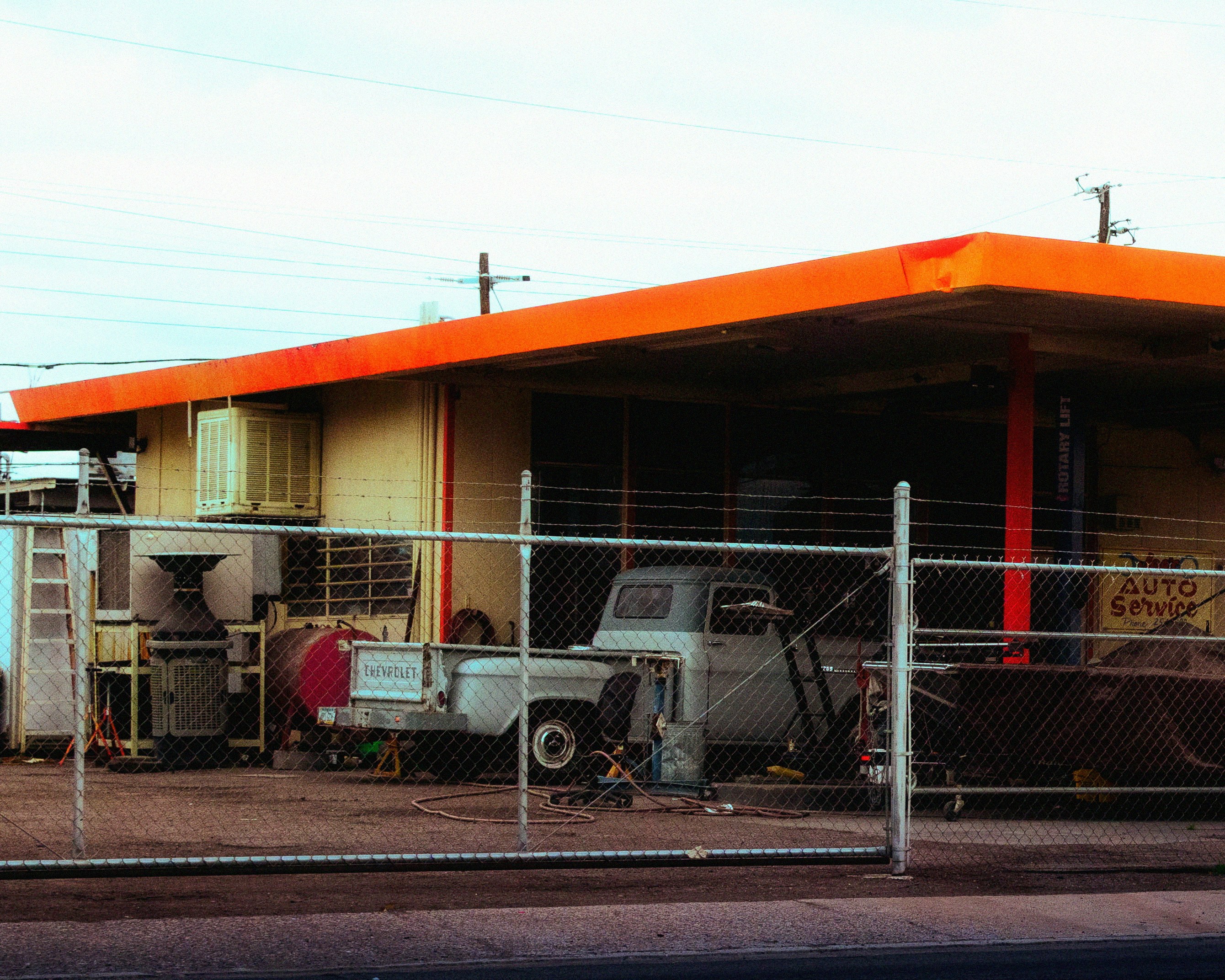 Row of used electric SUVs parked at a dealership lot ready for sale