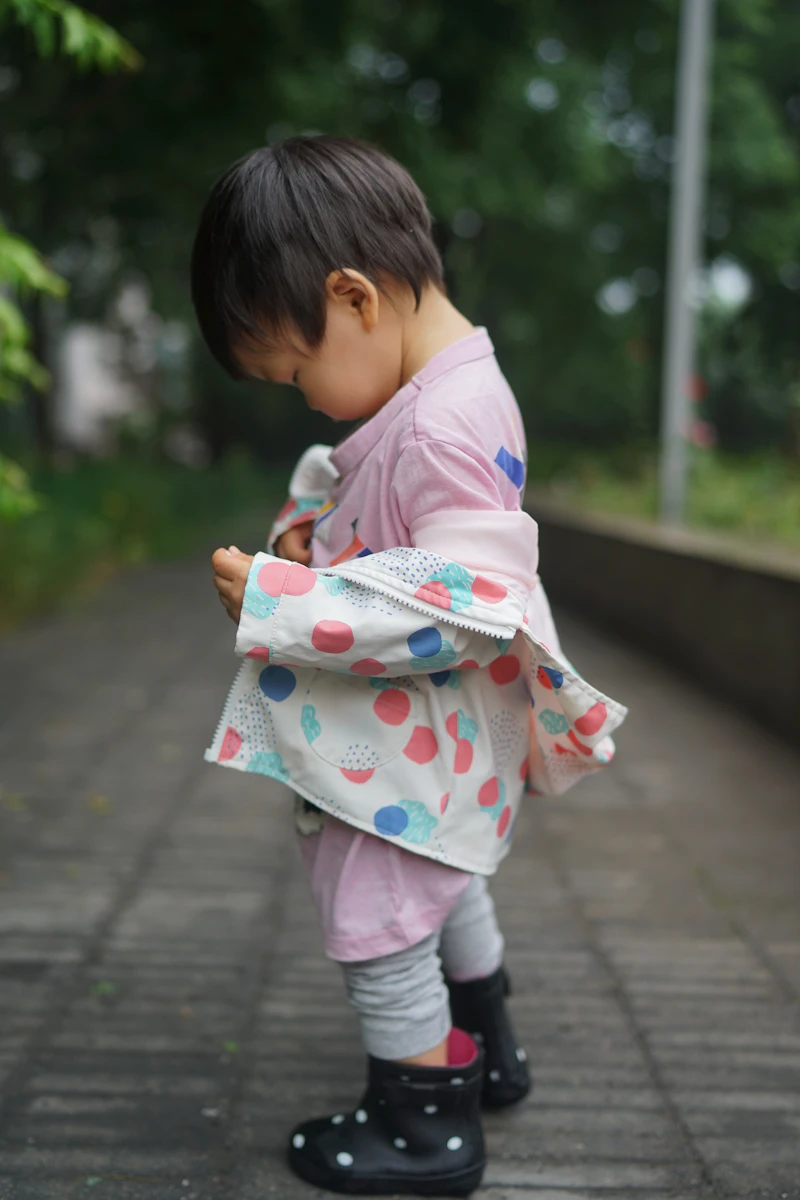 Child in a colourful printed kimono jacket
