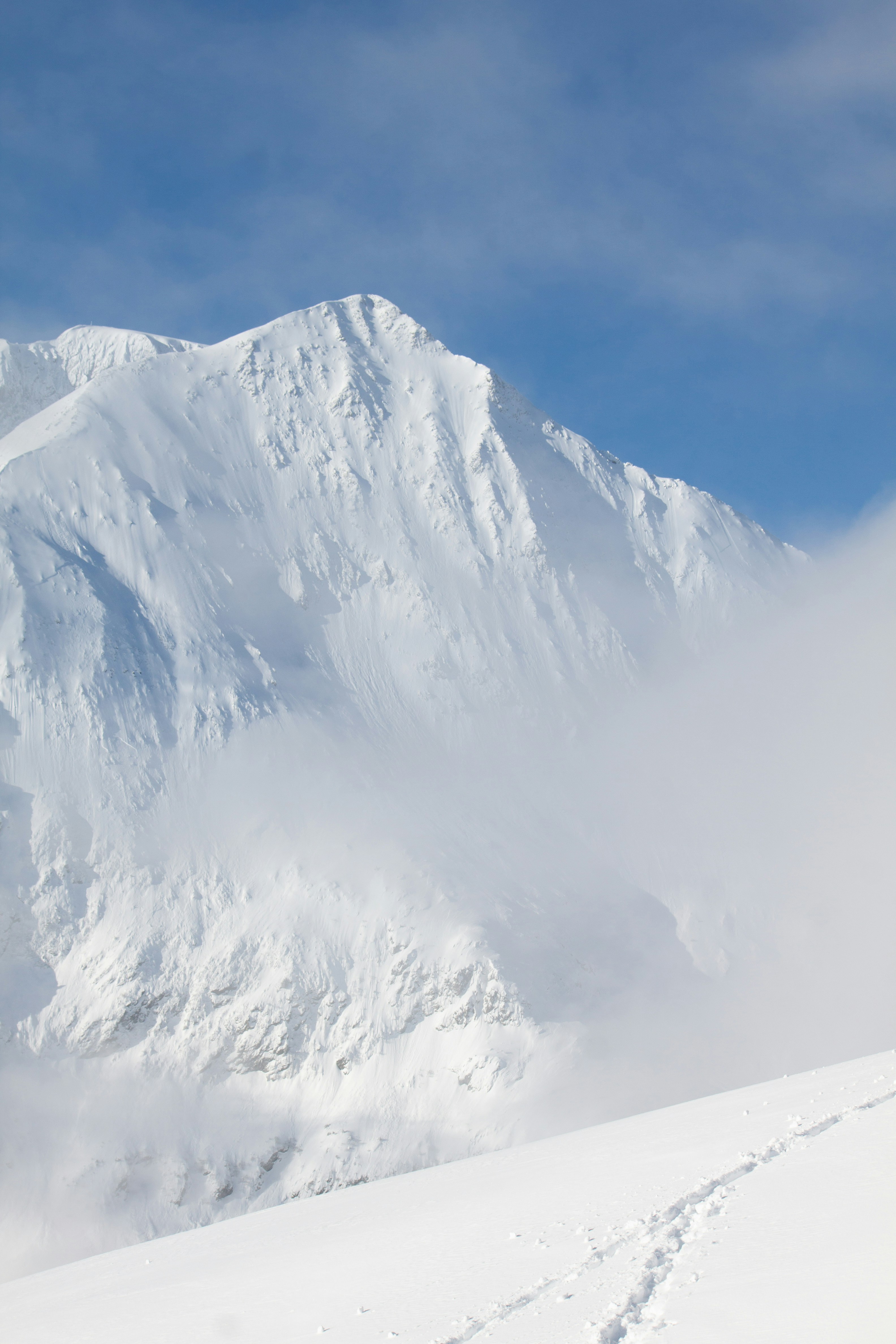 Snowy mountain peak against a clear blue sky. photo – Free Mountains ...