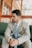 Man in suit sitting and looking away.